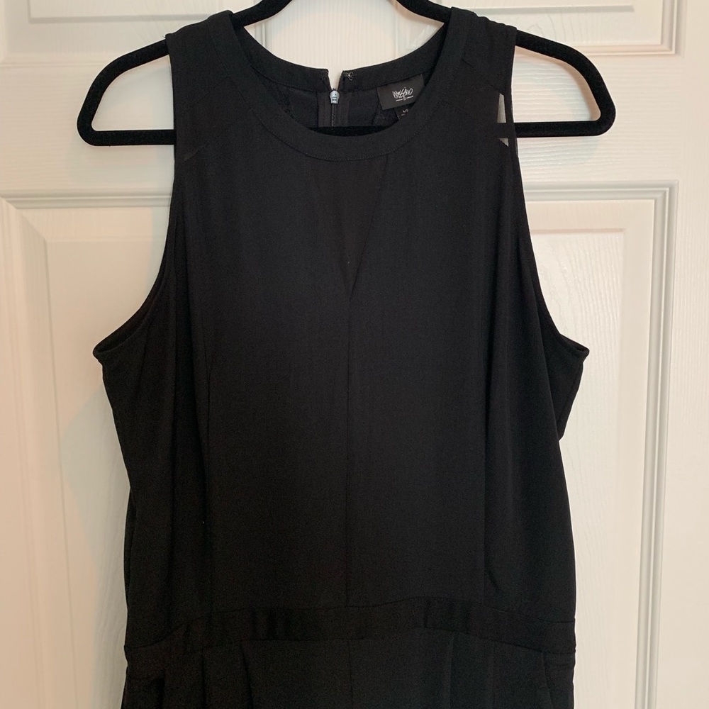 Black sleeveless pant romper.